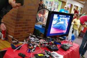 Jacob Burkamper attends to the quadcopter display during the 2nd Annual Cedar Rapids Maker Faire on April 27, 2013.