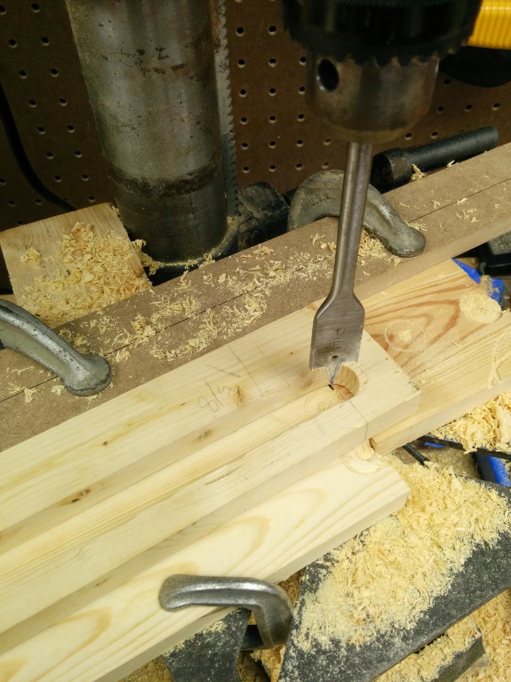 Started by drilling 3/4" holes, holes to match my 3/4" dowels in the scissors. 